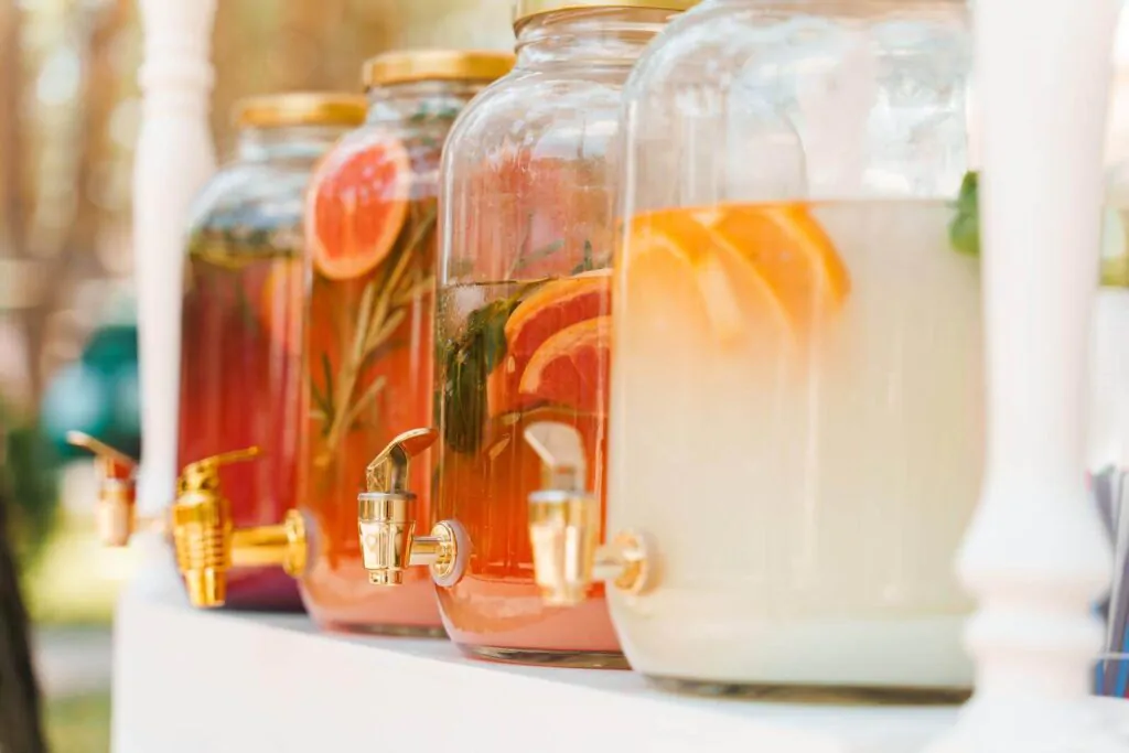 Lemonade dispenser with fruits: grapefruit, orange, lemon