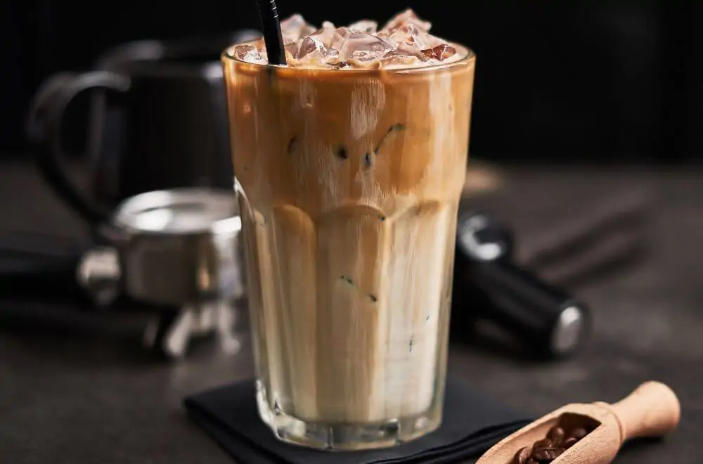 Ice coffee with cream in a tall glass