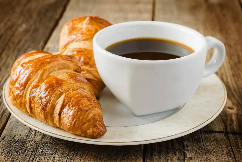 Croissants and coffee on a wooden table
