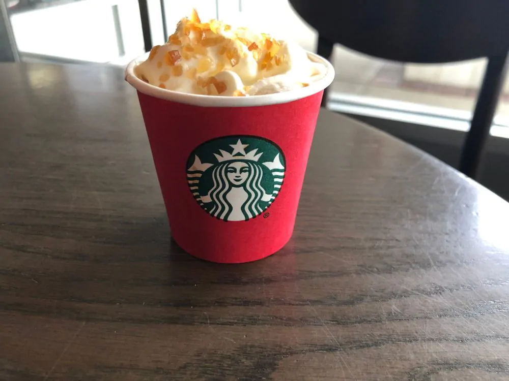 Starbucks Coffee samples of Caramel Brulee Latte in classic holiday red Starbucks Cups