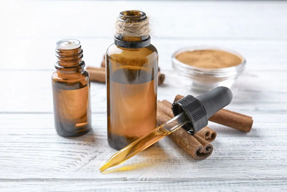 Essential cinnamon oil in glass bottles