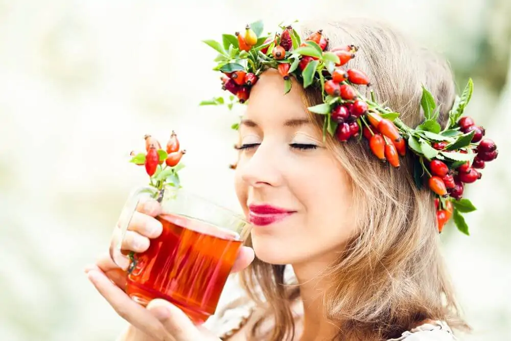 A beautiful woman drinking rosehip tea
