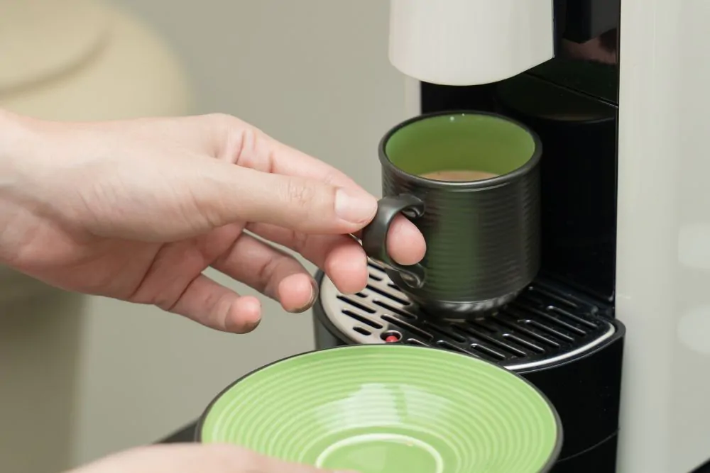 Capsule coffee machine making coffee