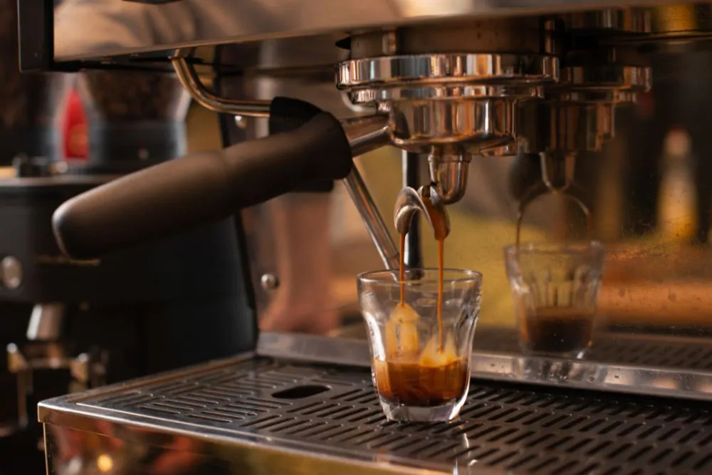 Espresso machine pouring espresso coffee