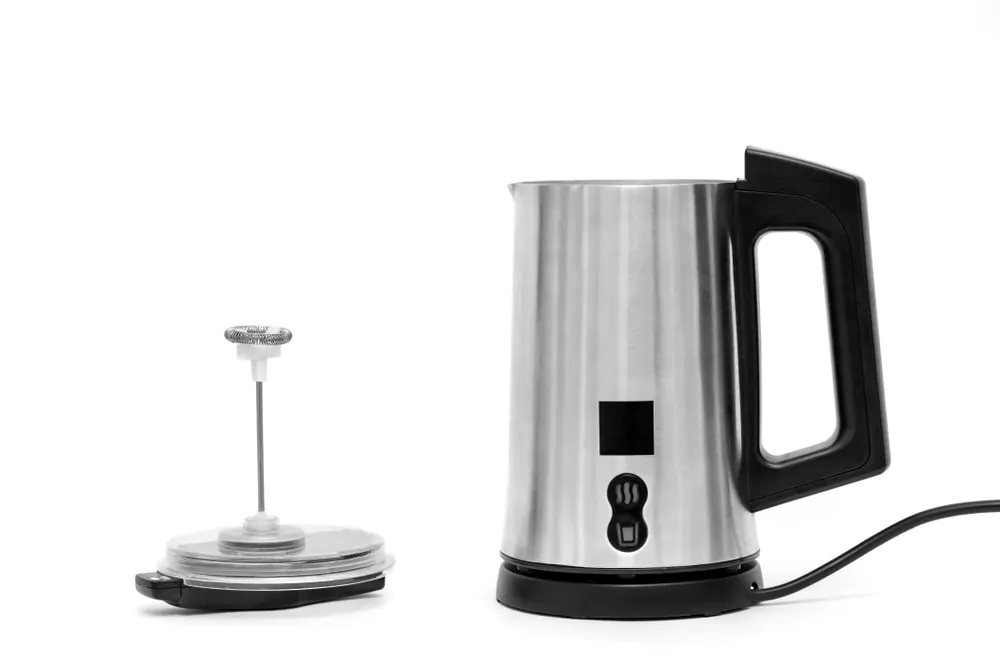 The milk foam maker is automatic. The frother is made of stainless steel with a black plastic top, handle, buttons and power cord