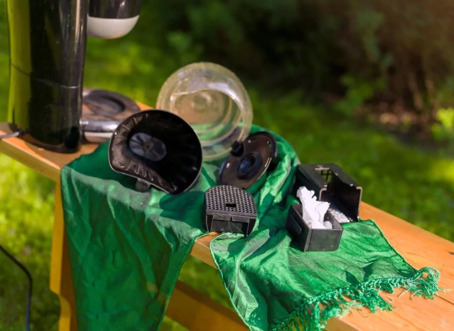 drying just washed coffee maker on a clean green cloth outdoor